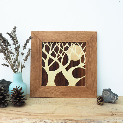 minimalist tree and moon silhouette marquetry wall hanging