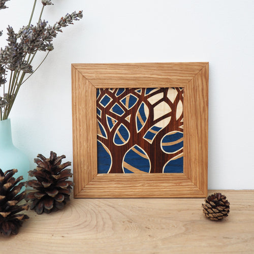 miniature blue tree and moon marquetry wall hanging